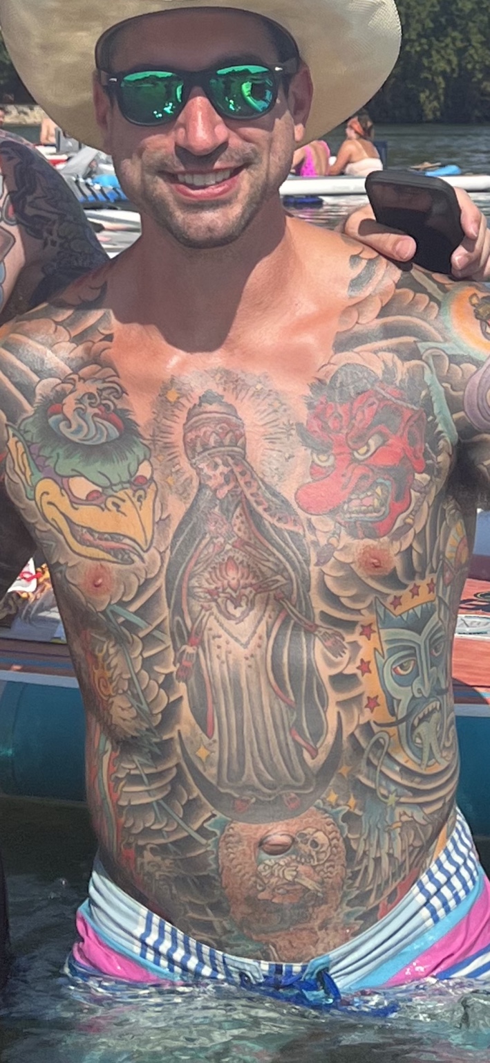 Healed Kappa and red Tengu tattoos on the two chest panels.
